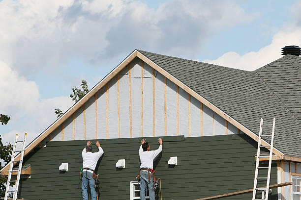 Professional Siding Installation technician working in Longboat Key, FL